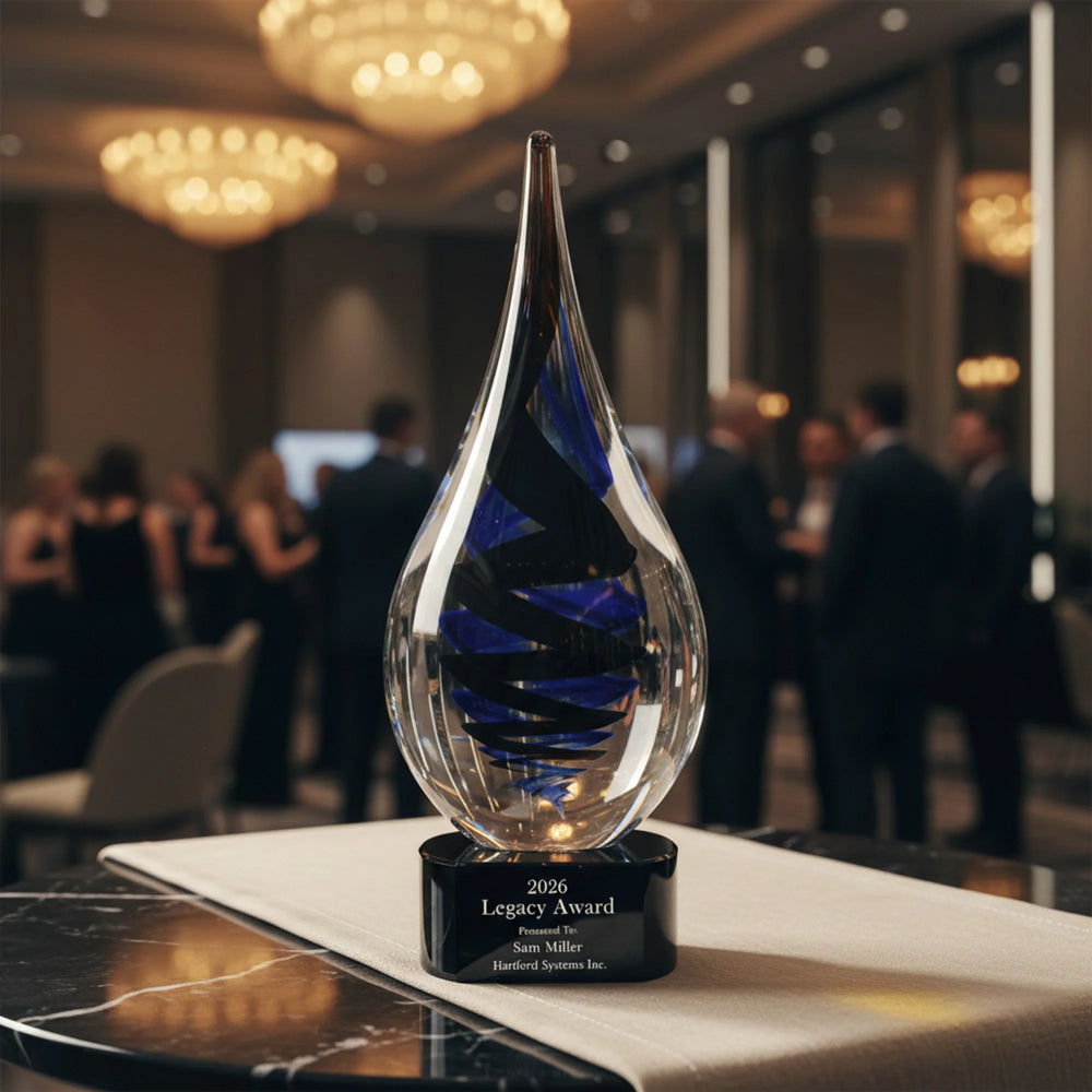 Glass award with blue interior on a desk in an office setting