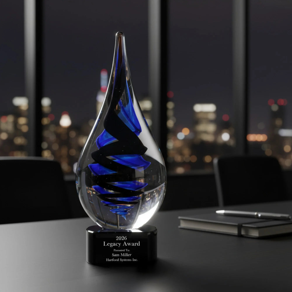 Glass award with blue interior on a desk in an office setting