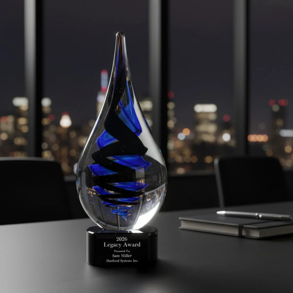Glass award with blue interior on a desk in an office setting