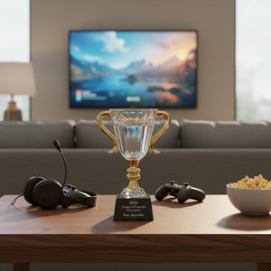 Glass trophy on a coffee table with gaming console and headset in a living room setting.
